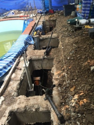 งานปรับดีดสระว่ายน้ำเอียง Micropiles for structure Jacking